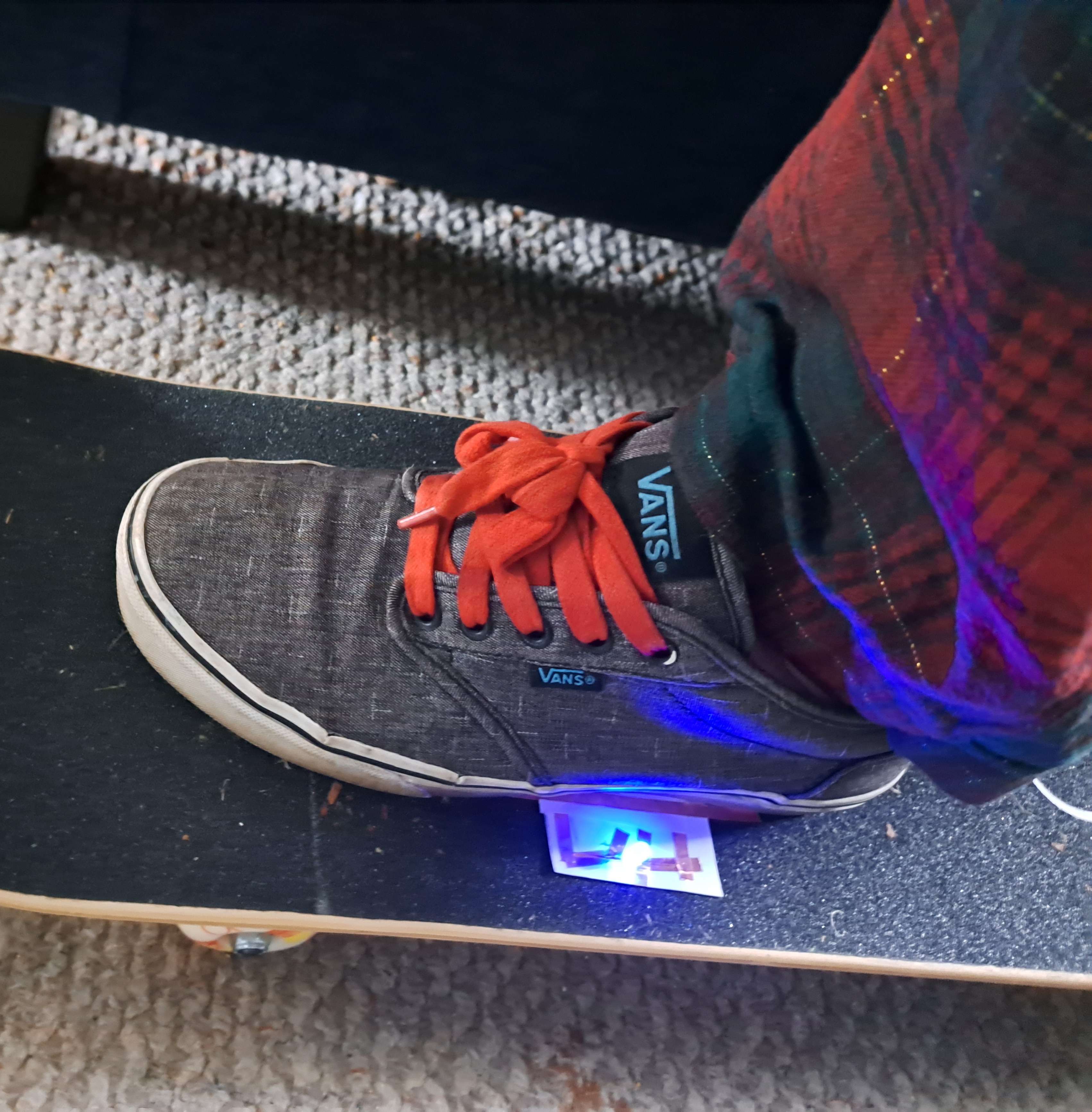 Skateboard with pad placed under front foot