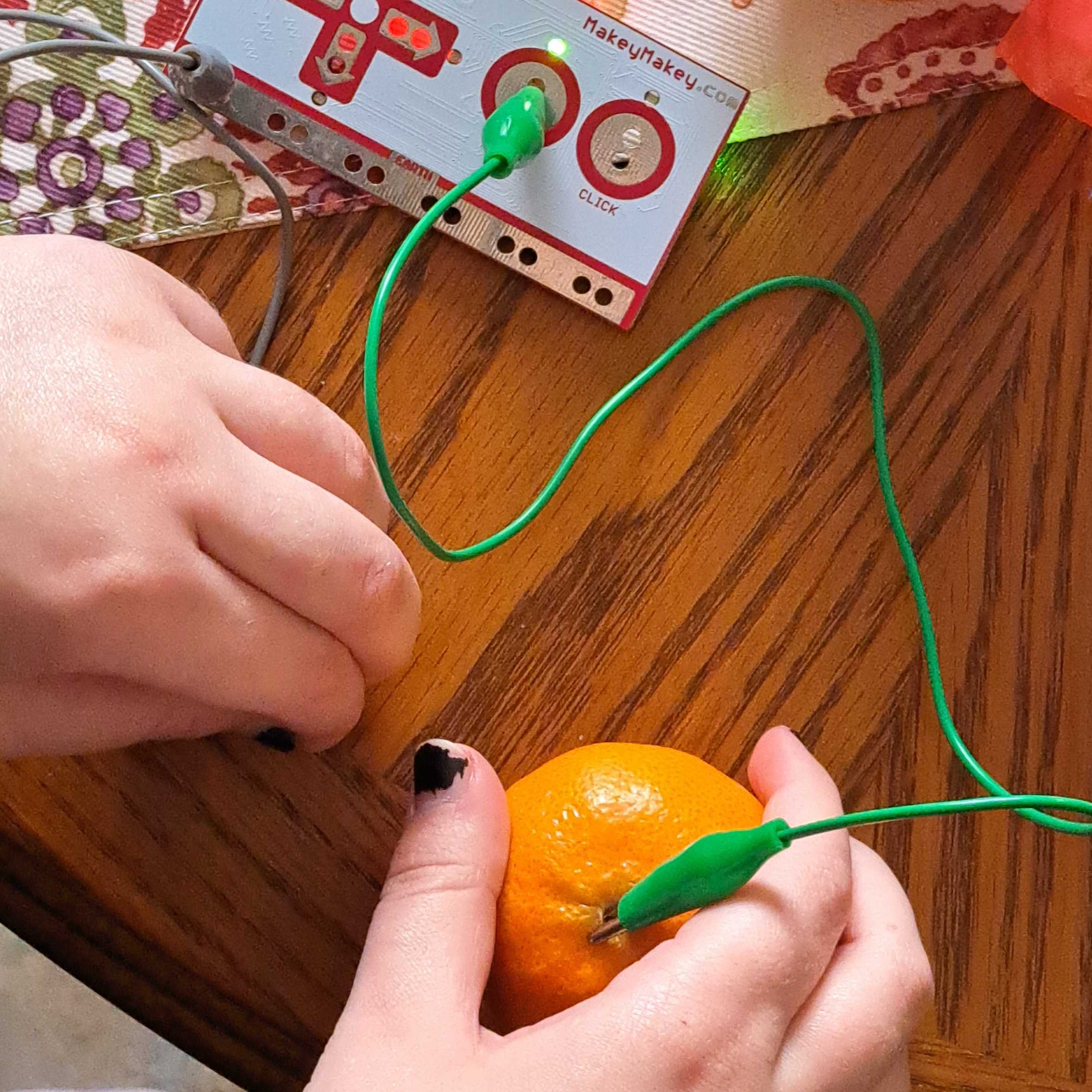 testing conductivity of foods<br>oranges are conductive